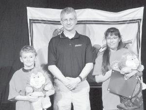 Cook County Chief Deputy and D.A.R.E. officer Leif Lunde with the 2009 D.A.R.E. essay contest winners Beckley Rumph (left) and Isabel Wahlers. The essay winners receive a stuffed D.A.R.E. lion.