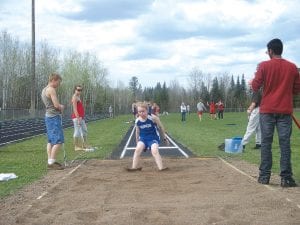 Photos by Rich Fortunato The Viking Track team competed in the Polar League Junior High Championships in Barnum on May 6. Never having tried the long jump before, Mara MacDonell and Lars Scannell gave it a try. Left: Mara made a terrific leap of 11'2