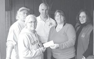 Photo courtesy of Boundary Country Trekking Gunflint Trail Nordic Ski trail managers recently presented a check to the Gunflint Green Up to plant trees as a way to 