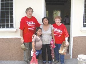 Upper left: Former Bethlehem Lutheran Pastor Bob Stoskopf painting a home in El Salvador. Pastor Bob and his wife, Dode, traveled to El Salvador with the North Shore Thrivent Financial crew. Above: Oz Twedt of Grand Marais and Dode Stoskopf were touched by the generosity of the El Salvadoran people. Lower left: Wayne Hensche of Hovland enjoyed the trip. He said, 