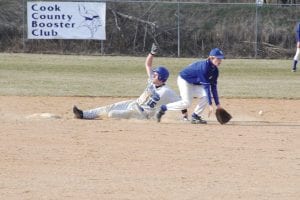 Photo by Bruce Johnson Casey Everson slides into second at a recent home game. Everson and his teammates had a good warm up for playoffs when they faced a Thunder Bay team on May 12.