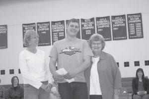 Paula Sundet of Cook County Higher Education presented the Michel S. Beaupre Trade Scholarship to CoLee Johnson. The scholarship is given in memory of Michel Beaupre, a master electrician, to encourage young people to master a trade. CoLee will be attending Central Lakes College for heavy equipment. Michel's wife, Bev Denyes (right) was also on hand and she recalled that she graduated from Cook County High School with CoLee's grandfather.