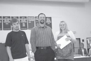 CCHS School Counselor Bryan Hackbarth presented scholarships from the Cook County Masonic Lodge of $1,500 to Mark Buckman and Lily Nelson-Pederson.