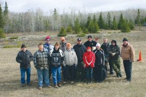 Staff photos/Rhonda Silence Top: The 2009 youth AT V safety class was small, but determined. They participated in the field testing in 30-degree weather and frigid winds on Saturday, May 16. (L-R) Volunteer Chuck Silence, Devyn Deschampe, instructor Steve Lashinski, Nathan Carlson, instructor Eric Nelms, Thomas Anderson, AT V Club president Mickey Brazell, Adrianna Berglund, DNR Conservation Officer Darin Fagerman, Raynee Wolke, instructor Kim Linnell, DNR Conservation Officer Mary Manning, and 2009 AT V Safety Instructor of the Year, Dick Parker.