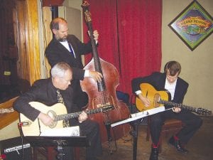 Below: The Clearwater Hot Club offering up swingin' late night Gypsy jazz at the Gun Flint Tavern Friday, May 22 during the 2009 Grand Marais Jazz Festival. Pictured, from left: Mark Kreitzer, Matthew Miltich, and Sam Miltich. Matthew Miltich is a former Cook County News-Herald writer.