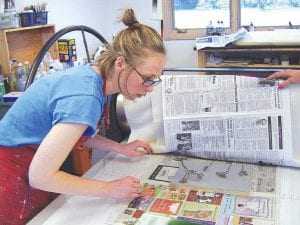 Staff photos/Jane Howard Above Left: Holly Beaster busy showing students the art of creating oil monoprints during an open house at the Grand Marais Art Colony Sunday, May 24, 2009. The Art Colony was part of the weekend's Grand Marais Jazz Festival, which included an 