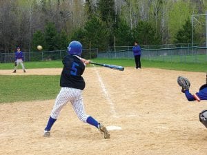 Left: Eighth-grader Kale Boomer, #5 at bat in the Saturday, May 9 tournament.