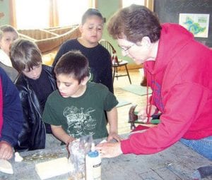 Top Right: Paraprofessional Rachel Drake assisting Randy Davis's third graders at North House. The project involved a lot of carving and sanding. (From left) Mikey Burton, Everett Morawitz, Jacob Fenner, Chance Finke, and Rachel Drake.