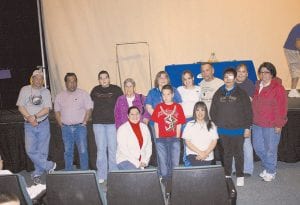 Staff photos/Rhonda Silence Left: Grandson Brent Sorenson presented a card from the Grand Portage Elementary School students, thanking Fish for all he has done for them.