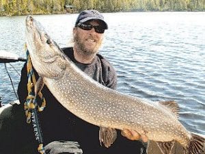 Roger Campbell of Poplar Lake on the Gunflint Trail caught this monster Northern—so big we needed two pictures to show its size!