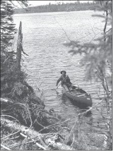 Left: Superior National Forest Guard Soderback on Clear Lake during a survey in 1921 with Forest Landscape Architect Arthur Carhart.