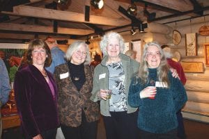 Staff photos/Rhonda Silence Above: Artistic women! Sandy Updyke of Moose Valley Photography, Maxene Linehan, Barb Wiltz, and Mary Jo Flack are a few of the talented people showing in the Hovland exhibit at Johnson Heritage Post. Above right: This lovely Inuksuk earthernware pot was handcrafted by Maxene Linehan. Right: Bremen Town Musicians (Hovland style) is a delightful carving by sculptor Don Ross. The show runs until June 21.