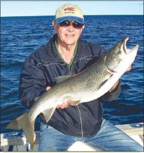 Photo by Darren Peck Chuck Johnson of Ranier, MN had an excellent day of fishing on Lake Superior with Captain Darren Peck of Tofte Charters. He shows off the 11 pound lake trout he caught on May 5, 2009.