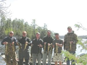 Photo by Alesha Manzo Visitors to Sagonto Resort on Lake Sagagana have caught some trophy fish in recent weeks! These anglers show off their May 21 walleye catches. (L-R) John Schwebach, St. Paul Park, MN; Justin Engels, White Bear Lake, MN; Matt Morrell, Woodbury, MN; Zach Goss, Woodbury, MN; Ben Dasovic, Hudson, WI; Mike Halleckson, Arden Hills, MN.