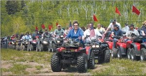 Staff photos/Rhonda Silence Here we go! Donna Lunke of Grand Marais, followed by Don McKeever of Schroeder, and a number of other Cook County riders, finally got to join the five-mile parade of ATVs in the world-record breaking ATV parade in Silver Bay on Saturday, June 13.