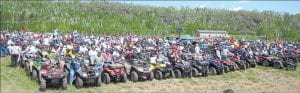 Photo by Nancy McReady AT Vs lined up, row-by-row in the field next to the Silver Bay AmericInn. Riders were excited about being part of breaking the world record for the longest AT V parade in Silver Bay on Saturday, June 13.