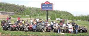 Above: Some of the approximately 50 AT Vers from Cook County gathered in the field next to the Silver Bay AmericInn after the world-record breaking AT V parade. Many riders are not pictured—they headed out to enjoy the beautiful Silver Bay area trails.