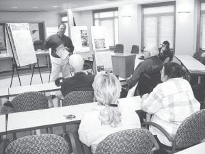 Staff photo/Jane Howard Mike Fischer, vice president of Minnesota-based consulting firm LHB, helped facilitate a community discussion at the courthouse Tuesday, June 16, 2009 on the possibility of building a civic/community center in Grand Marais. The facility would be funded by a countywide 1% sales tax that would need to pass a referendum in November. Amenities could include a large multi-purpose gymnasium, a fitness center, party space, meeting rooms, a commercial kitchen, and an aquatic center.