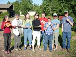 Members of the Northwoods Food Project get ready to break ground for the community garden at WTIP. Pictured, from left, are Melinda Spinler, Joan Farnam, Julie Kean, Jeanne Wright, Jim Zunker, Amy Demmer, WTIP Station Manager Deb Benedict, and David Demmer.