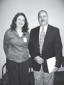 Lawrence Massa, president of the Minnesota Hospital Association, standing with Cook County North Shore Hospital Administrator Diane Pearson. Massa met with North Shore Hospital and Sawtooth Mountain Clinic staff and board members Wednesday, July 1, 2009, updating them on the association's advocacy efforts on behalf of Minnesota hospitals. Massa set out to visit all 147 of Minnesota's hospitals when he began his tenure last October.