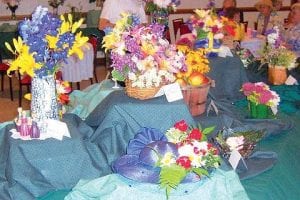 Bouquets brighten the Schroeder Town Hall at the West End Garden Club Show.