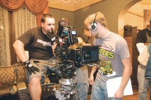 Left: Cook County High School graduates David Riehm (left) and Kyle Ford, now film students at Moorpark College, California, review a scene while filming the thriller The Room.