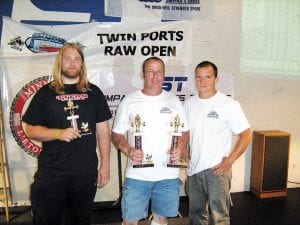 Upper Shore Fitness members Barry Shaw, Seth Falk, and Cory Pederson recently competed in the Twin Ports Raw [no supportive gear] power lifting competition in Duluth. Power lifting consists of three lifts—the squat, the bench press, and the dead lift. Barry set national records in his weight and age class in the total of all three lifts—1353 pounds and in the squat with a lift of 512.6 pounds. He also earned second place meet trophies in the Masters and Open Men's lightweight. He was beat by a national champion. Seth and Cory were competing for their first time with Seth finishing in third place in the Junior age 23 and under] class with a total of 1182.5 pounds. Cory also did an excellent job in his weight class, with only about three weeks of power lifting practice—852.5 lbs. Congratulations to the Cook County power lifters!