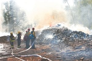 Tofte, Schroeder and Lutsen firefighters and US Forest Service personnel battled a massive unplanned bonfire at the Bluefin Bay maintenance area in Tofte on Monday, July 6.