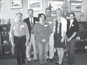 Above: Representatives of area agencies receiving grants from the Cook County Community Fund attended the awards program Tuesday, June 23, 2009 at Sivertson Gallery. From left: Don Hammer of the Grand Marais Art Colony; Dean Grace of the North Shore Collaborative; Patty Nordahl of Cooperation Station; Karl Hansen of the North Shore Health Care Foundation; Paula Sundet of Cook County Higher Education; Howard Hedstrom, Cook County Community Fund board chair; and Diane Booth of the Cook County Extension Office. Left: The crowd mingled amidst the artwork at Sivertson Gallery Tuesday, July 23, 2009 before the 6th annual Cook County Community Fund awards program. Seven local agencies received grants totaling $7,000.