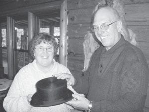 Staff photos/Jane Howard Top: Gunflint Trail Historical Society President Sue Kerfoot shows Jim Edlund a beaver hat she found on E-Bay. It will be part of a Voyageur exhibit at Chik-Wauk Museum and Nature Center, scheduled to open July 4, 2010.