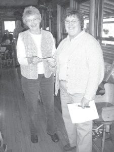 Above Right: Lee Zopff of the Mid-Trail Property Owners Association (left) hands Gunflint Trail Historical Society President Sue Kerfoot a check for $1,100. The association donated the proceeds from a meal and snack they had provided to bicyclists traveling with Jim Klobuchar's 356h annual Jaunt with Jim last month. The money will be used for Chik-Wauk Museum and Nature Center, which will is scheduled to open July 4, 2010. Above Left: This quilt, handcrafted by Melissa Anderson, will be raffled off by the Gunflint Trail Historical Society to raise money for Chik-Wauk Museum and Nature Center. The lucky winner will be announced at the museum's opening July 4, 2010. Tickets will be available at numerous functions around the county until then.