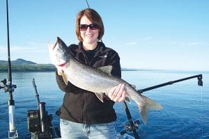 Nicole Bowe from Hugo, MN had a great day of fishing on Lake Superior on June 26 with Captain Darren Peck of Tofte Charters. Nicole is pictured with a beautiful lake trout.