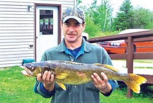 Kyle Corwin of Grand Rapids with the 11 pound 2 ounce walleye he caught on an area lake.