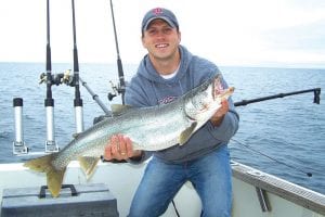 Dustin Bengtson of Hastings, MN with a beautiful 12.3-pound lake trout caught while fishing on Lake Superior with Tofte Charters on July 1, 2009.