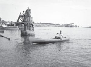 Canoe races were part of the fun of the Fisherman's Picnic for many years. This race in 1948 provides a definitely different view of the Grand Marais harbor. The young boys watching the race are on the oil dock that served the Grand Marais Standard Station. See more historic Fisherman's Picnic photos in the News-Herald special Fisherman's Picnic section!