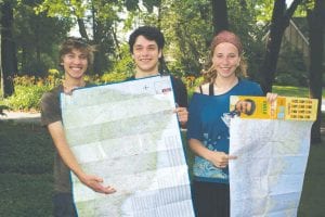 CCHS students (L-R) Cedric Holtz, Gavin Danfelt-Martin, and Martha Wilkes will be spending their senior year in South America as Rotary Youth Exchange students. They are holding maps of their countries: Brazil and Chile and are pointing to where they will be going. They attended Central States Rotary Youth Exchange Program Summer Conference in Grand Rapids, Michigan July 10 - 12.