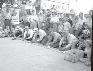 An exciting competition of Fisherman's Picnic past was a Herring Filet Contest. These gentlemen got into the spirit of things in hats and ties in 1948 Fisherman's Picnic. The event seems to have been a crowd pleaser. And notice—just about everyone is wearing their Fisherman's Picnic button! See more historic Fisherman's Picnic photos inside!