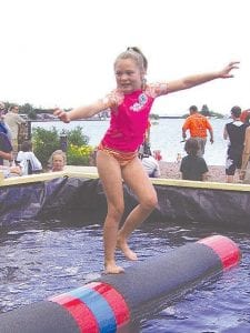 The log rolling tournaments last year were fun to watch. Practicing her skills was Claire LaVigne. If you'd like to try logrolling, stop by the Lumber Camp. World Champion logroller Jenny Atkinson would be happy to give a mini lesson and let you take a spin on the cedar!