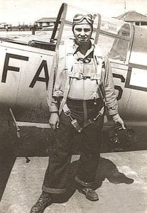 Below left: Airman McClanahan at Mossio, Brazil. He is ready for flight, wearing a parachute and life vest and holding his K-16 recording camera.