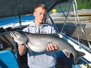 Photo courtesy of the family Jeremy Dockan of Pasadena, Texas caught this beautiful lake trout near Isle Royale. Jeremy comes to Grand Marais to visit his grandparents, Gladys and George Dockan, every summer. He is the son of Steve and Belinda Dockan. Brian Olson of Devil's Track Lake was the guide on this most prosperous fishing trip!