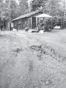 Staff photo/Jane Howard The driveway washout below the horse park on Creechville Road in Grand Marais.