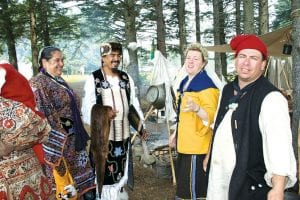 Above: Grand Portage Rendezvous includes the best of all worlds, blending cultures in both historic and modern times. That is the appeal of Rendezvous, explains voyageur reenactor Terry Cheney. 