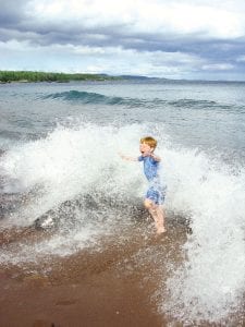 Photo by Jennifer Updyke Ismail Wrapping up summer with a splash! Benjamin Ismail, from Cairo, Eygpt, was visiting family in Grand Portage recently. He enjoyed the beach and reveled in splashing in the waves at Red Rock Bay.