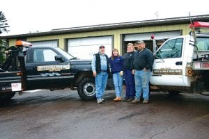 File photo/Rhonda Silence Paul and Pam James, of Nelson's Towing, have a new home for their tow trucks.