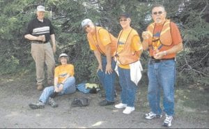 Photos by Kim Carlsted-Gillis Top: (L-R) Mike Garey, Kris Garey, Ken Bjorklund, Diane Bjorklund, and Burt Carlsted-Gillis taking a break during the Trinity Lutheran 100th anniversary walkathon that honored pastors who once walked from Grand Marais to Hovland to serve their parish. Above Left: Walkathon participants were sent off from Bethlehem Lutheran with prayers and blessings. Above Right: John Redshaw on Java (left) and Stan Pelto on Cadence made the trek from Grand Marais to Hovland to help Trinity Lutheran Church celebrate its 100th anniversary.