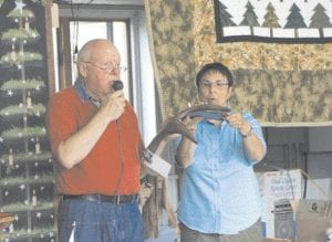 Photo by Nancy Ullrich The Gunflint Mid-Trail Property Owners Association once again hosted an amazing auction on Saturday, August 15. Auctioneer Phil Serrin, assisted here by Janet Little, kept bidders on their toes as they vied for a beautiful handmade diamond willow table, handcrafted jewelry, cozy blankets and more. Winning the beautiful quilt raffle was Natalie Rogers from Ishpeming, MI. She is the mother of Darlene Katajamaki, who with her husband owns Loon's Nest Gifts on the Trail. The event raised $5,625 for the Gunflint Volunteer Fire Department.