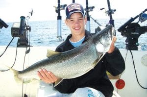 Photo courtesy of Tofte Charters Ross Kellermeier of Edina MN had an awesome day of fishing with Captain Daren Peck aboard Tofte Charters on August 17, bringing in the 17-pound lake trout. The trout was released.