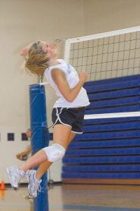 Staff photos/Rhonda Silence Viking volleyball practice started with captains' practice on August 10 with players from all three squads joining in on August 17. The squads took turns facing off against the volleyball automat. Above: JV player Sarissa Falk gets airtime to spike the ball.