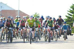 Staff photos/Laurie Johnson The starting lineup of the Sawtooth Mountain Challenge in downtown Grand Marais on Sunday, August 23. The race leads bicyclists up a 600-foot vertical climb to Pincushion Mountains. Especially impressive were the young boys in the under 11 years group!