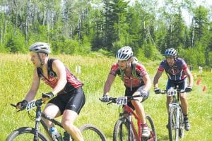 The top three finishers in the men's 24-mile race hung together through several laps. They are (L-R) Nikolai Anikin, Duluth, 2nd place; Joshua Tesch, Superior, WI, 1st place; and Ted Loosen, Minneapolis, 3rd place.